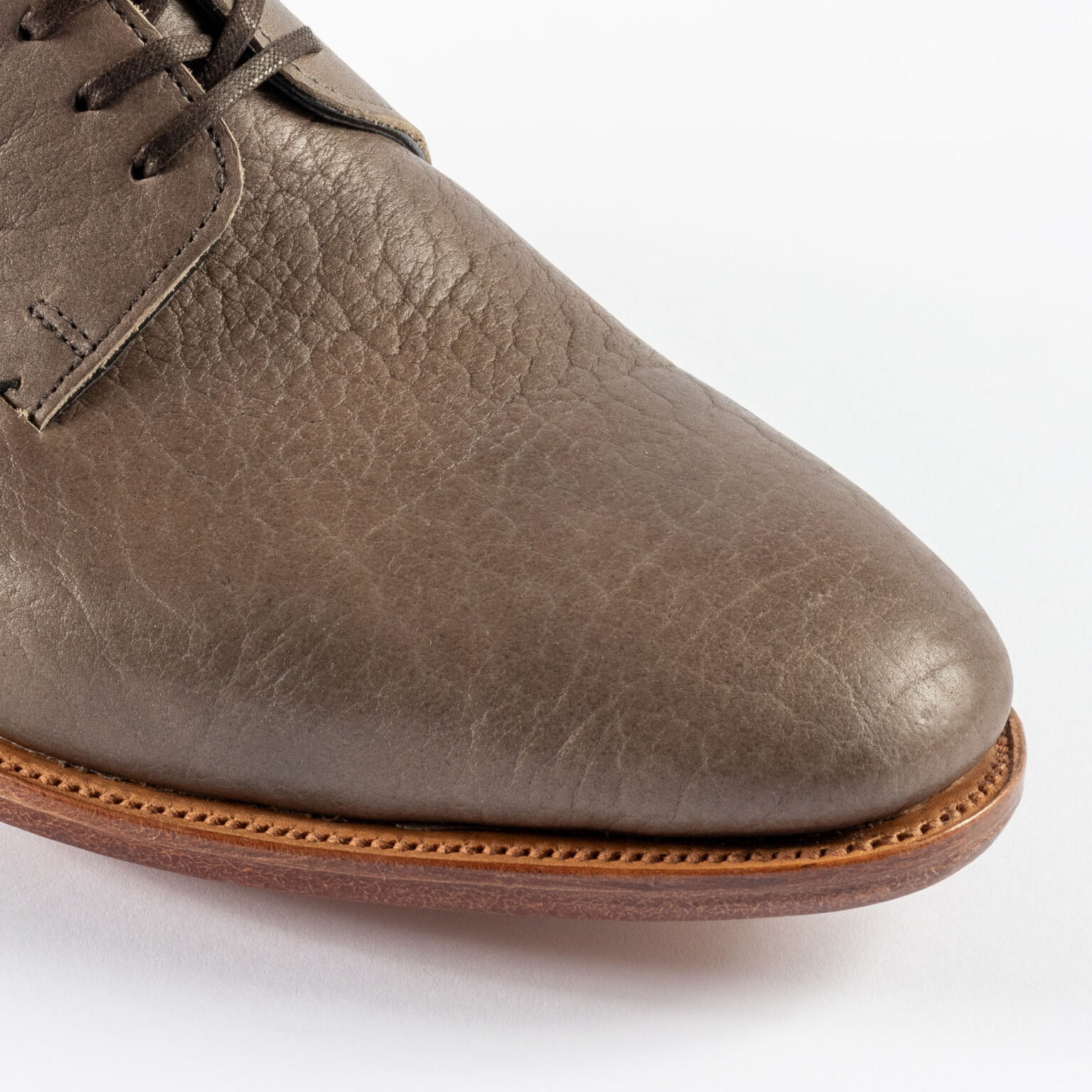 Closeup of vamp and toe of Kennington Gibson in Grey Horween Veg Tanned Bison without medallion