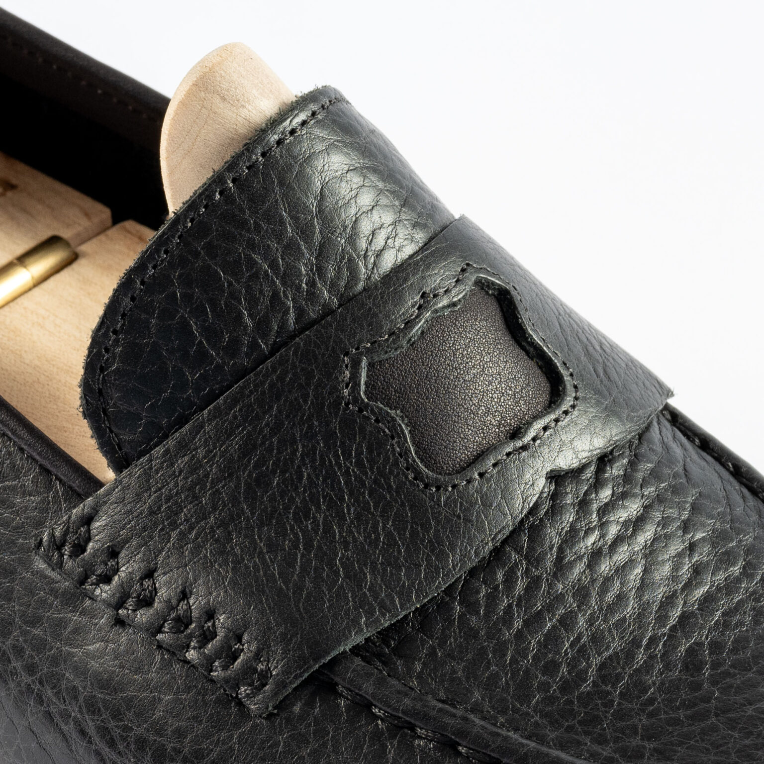 Closeup of penny strap on Watling Penny Loafer in Black Horween Veg Tan Bison